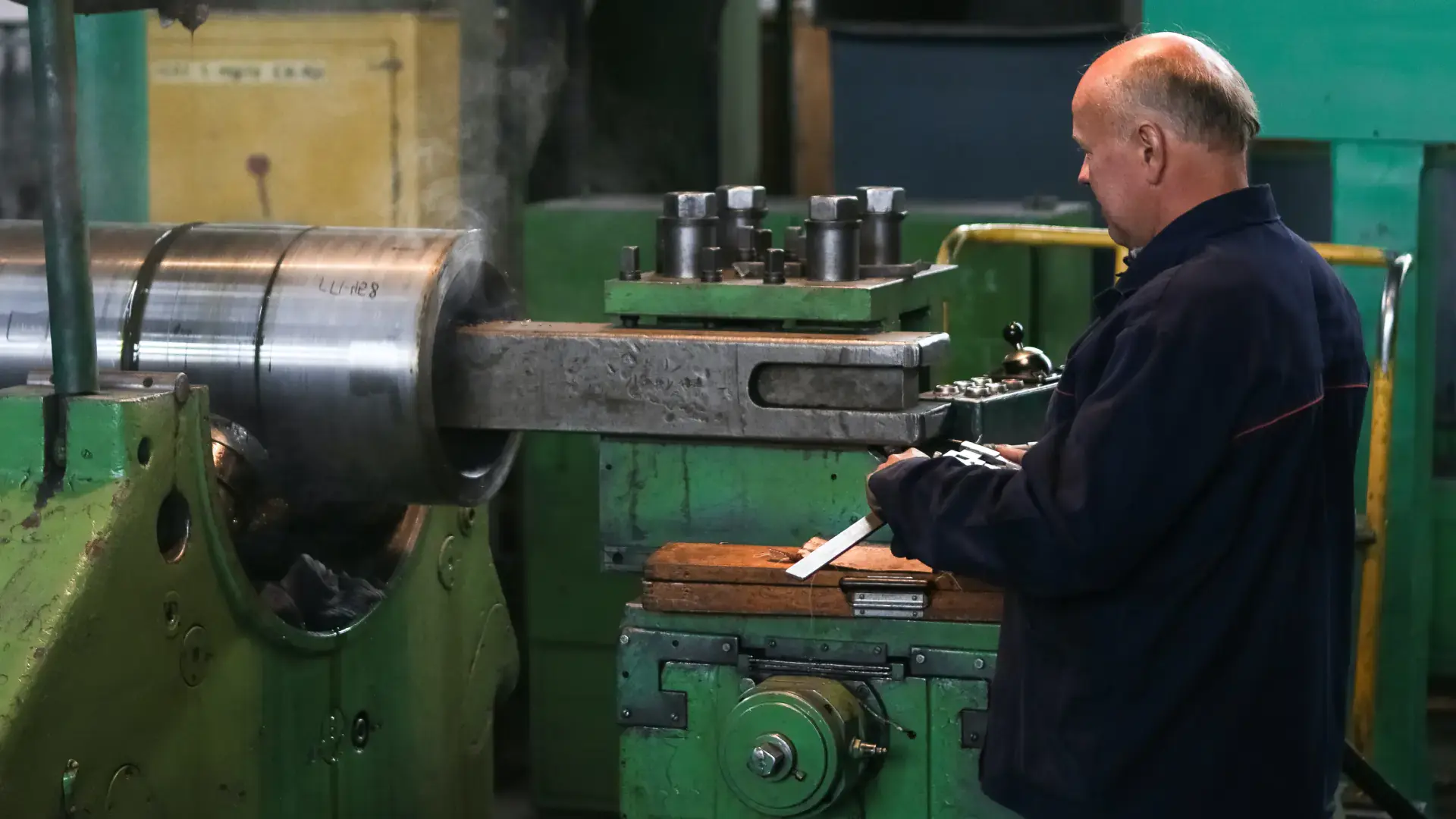Worker operating industrial machine